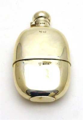 Lot 2288 - An Edwardian Silver Hip Flask, G & J W Hawksley, Sheffield 1902, plain oval with a pull off cup and