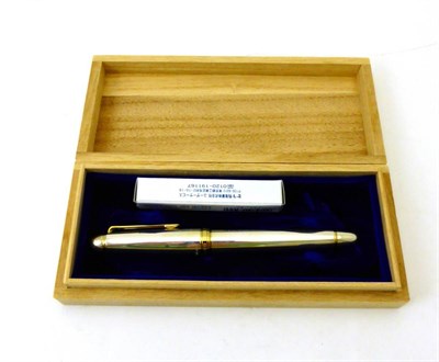 Lot 2319 - Sailor: A Sterling Silver Fountain Pen, nib: M, with a plain tapering body and cap, in original...