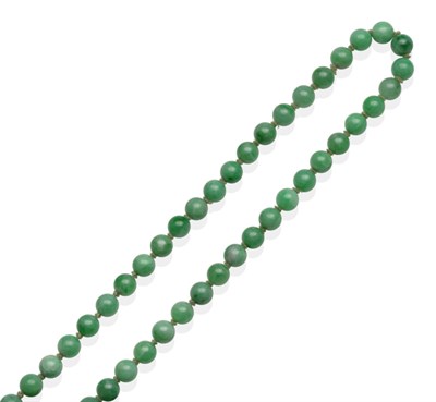 Lot 2022 - A Jade Necklace, a continuous strand of uniform jade beads, 66cm long see illustration