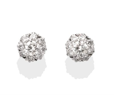 Lot 2023 - A Pair of Diamond Cluster Earrings, a round brilliant cut diamond within a border of smaller...