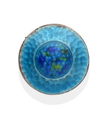 Lot 2028 - A Silver and Enamel Circular Brooch, by James Fenton, of hammered design and enamelled in tones...