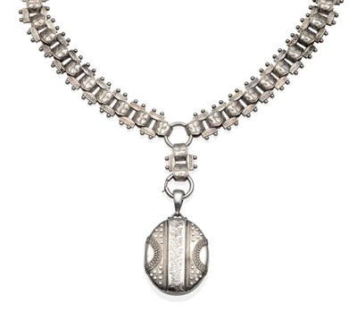 Lot 2029 - A Victorian Silver Locket on a Chain Necklace, the oval locket with applied beaded and chased...