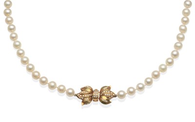 Lot 2038 - A Cultured Pearl Necklace with a Diamond Set Clasp, uniform cultured pearls knotted to a bow...