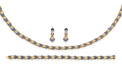 Lot 2040 - A Sapphire and Diamond Necklace, Bracelet and Earring Suite, groups of three graduated marquise cut