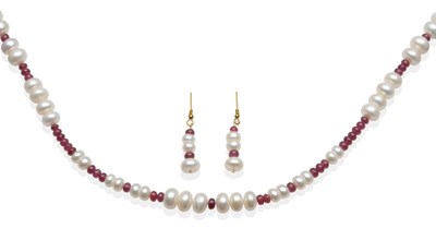 Lot 2045 - A Cultured Pearl and Ruby Bead Necklace and Earring Suite, graduated cultured button pearls...