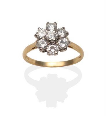 Lot 2059 - An 18 Carat Gold Diamond Cluster Ring, a round brilliant cut diamond within a border of six...