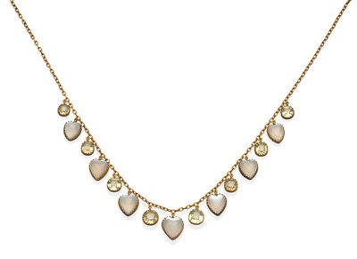 Lot 2063 - A Moonstone and Chrysoberyl Necklace, seven graduated heart shaped cabochon moonstones...