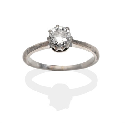 Lot 2072 - A Diamond Solitaire Ring, an old cut diamond in a white claw setting, to knife edge shoulders...