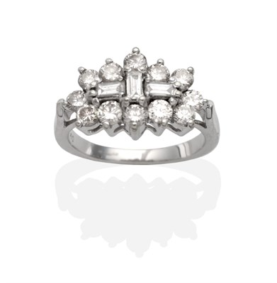 Lot 2076 - An 18 Carat White Gold Diamond Cluster Ring, three baguette cut diamonds within a border of...