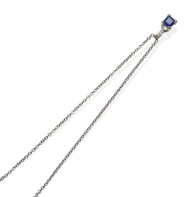 Lot 2080 - An 18 Carat White Gold Sapphire and Diamond Pendant on Chain, a square cut sapphire in a white four