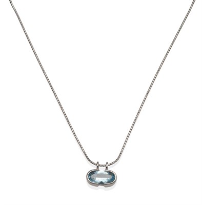 Lot 2086 - A 9 Carat White Gold Blue Topaz Pendant, an oval cut blue topaz in a half rubbed over setting, to a