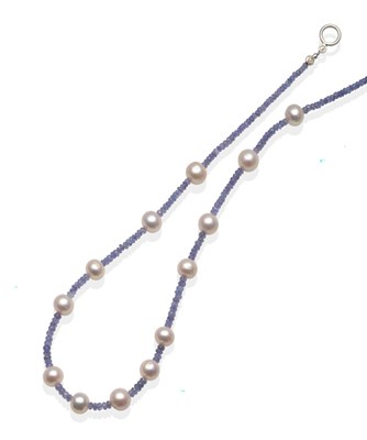 Lot 2088 - A Cultured Pearl and Tanzanite Bead Necklace, round cultured pearls spaced by groups of faceted...