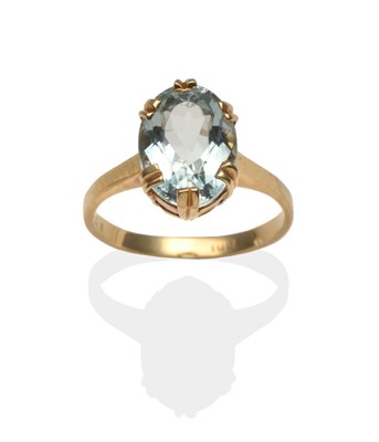 Lot 2092 - An Aquamarine Ring, an oval cut aquamarine in a yellow double claw setting on a plain polished...