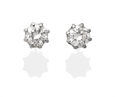 Lot 2116 - A Pair of Diamond Solitaire Earrings, a round brilliant cut diamond in a white claw setting,...