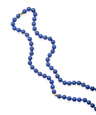 Lot 2122 - A Lapis Lazuli Bead Necklace, a continuous strand of uniform round lapis lazuli beads spaced at...