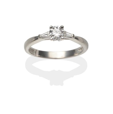 Lot 2126 - A Platinum Diamond Solitaire Ring, a round brilliant cut diamond in a four claw setting to...