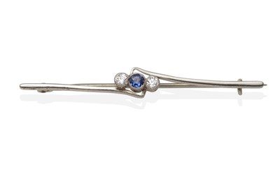 Lot 2128 - A Sapphire and Diamond Bar Brooch, a round cut sapphire between two old cut diamonds in white...