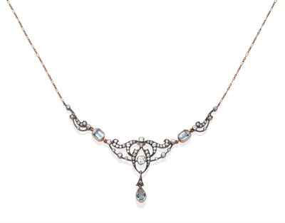 Lot 2130 - An Edwardian Aquamarine and Diamond Necklace, of open scroll design and set throughout with old cut