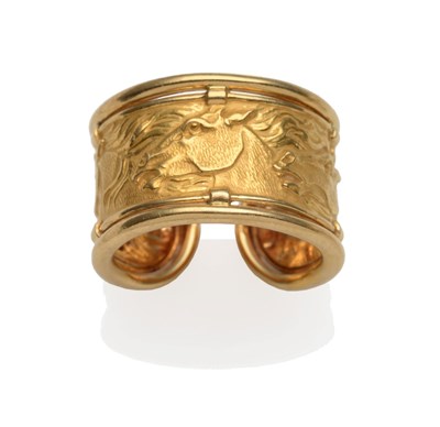 Lot 2143 - A Cuff Ring, by Carrera Y Carrera, embossed with a horse motif, between two bright polished...