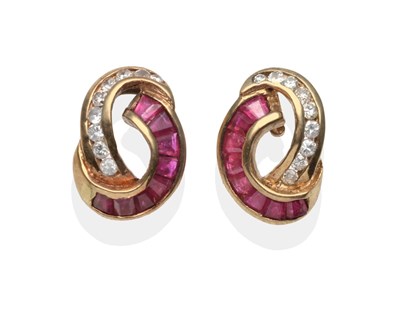 Lot 2149 - A Pair of 9 Carat Gold Ruby and Diamond Earrings, scrolls channel set with calibré cut rubies...