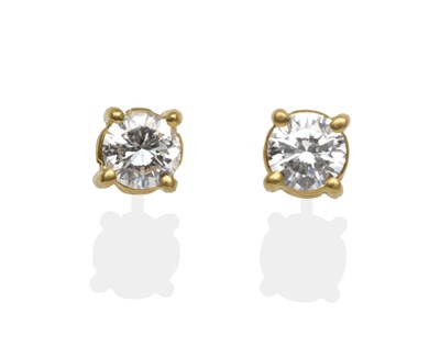 Lot 2152 - A Pair of 18 Carat Gold Diamond Solitaire Earrings, a round brilliant cut diamond in a yellow...