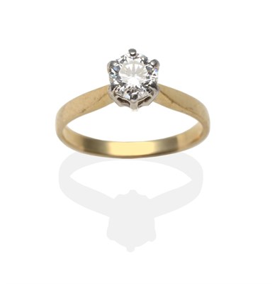 Lot 2160 - A Diamond Solitaire Ring, a round brilliant cut diamond in a white claw setting, to yellow...