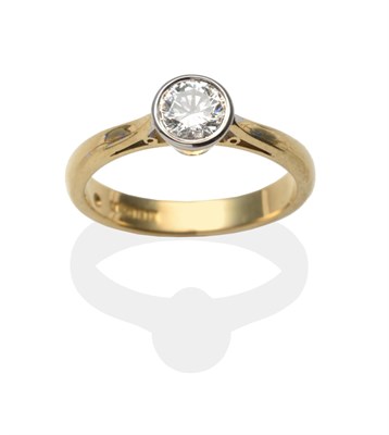 Lot 2167 - An 18 Carat Gold Diamond Solitaire Ring, a round brilliant cut diamond in a white rubbed over...