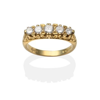 Lot 2171 - An 18 Carat Gold Diamond Five Stone Ring, graduated round brilliant cut diamonds in a yellow carved