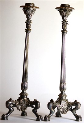 Lot 2206 - A Pair of Late Victorian Silver Plated Candlesticks, with leaf sheathed sockets, fluted...