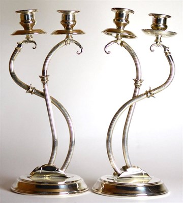 Lot 2213 - A Pair of Italian Silver Two-Light Candelabra, Florence, post 1968, with urn sconces on fluted...