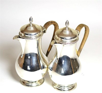 Lot 2231 - A Pair of George V Silver Water Jugs, John Henry Rawlings, London 1915, of baluster form with...