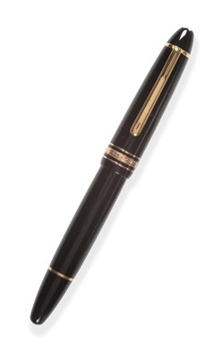 Lot 2302 - A Fountain Pen, signed Mont Blanc, Meisterstuck No.146, the black surfaces with gold coloured...