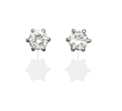 Lot 2009 - A Pair of Diamond Solitaire Earrings, a round brilliant cut diamond in a claw setting, total...