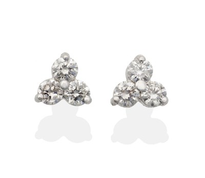 Lot 2017 - A Pair of 18 Carat White Gold Diamond Trefoil Cluster Earrings, three round brilliant cut...