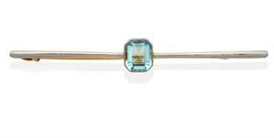 Lot 2020 - An Aquamarine Bar Brooch, an octagonal cut aquamarine in a milgrain setting to a tapered bar,...