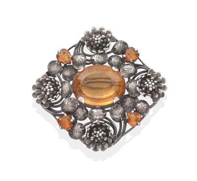 Lot 2034 - An Arts & Crafts Citrine Brooch, by Edith Linnell, an oval cut citrine in a claw setting within...