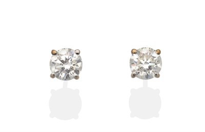 Lot 2041 - A Pair of 18 Carat Gold Diamond Solitaire Earrings, a round brilliant cut diamond in a claw...