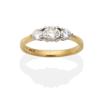 Lot 2045 - An 18 Carat Gold Diamond Three Stone Ring, graduated round brilliant cut diamonds in claw settings