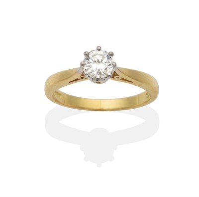 Lot 2047 - An 18 Carat Gold Diamond Solitaire Ring, a round brilliant cut diamond in a white claw setting,...