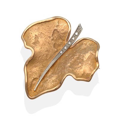 Lot 2051 - A Diamond Leaf Brooch, an ivy leaf with a brushed finish within a bright polished frame with a stem