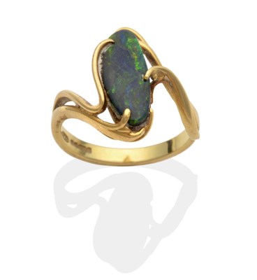 Lot 2052 - An 18 Carat Gold Black Opal Ring, an abstract oval black opal to scroll twist shoulders, finger...