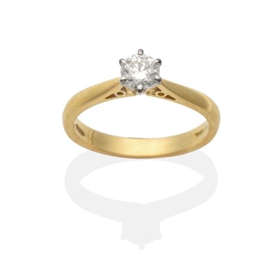 Lot 2055 - An 18 Carat Gold Diamond Solitaire Ring, a round brilliant cut diamond in a claw setting, to...