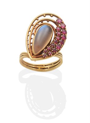 Lot 2063 - An 18 Carat Gold Moonstone and Ruby Cluster Ring, by Clare Street, a pear cut moonstone in a rubbed