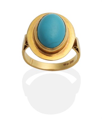 Lot 2065 - A Turquoise Ring, an oval turquoise in a rubbed over setting within an oval frame, to tapering...