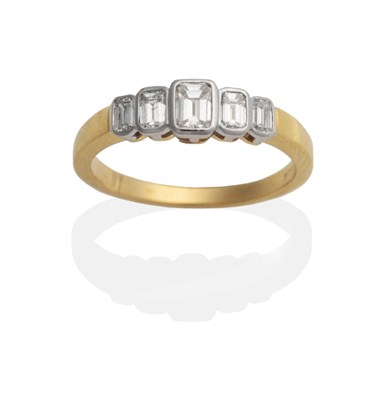 Lot 2069 - An 18 Carat Gold Diamond Five Stone Ring, octagonal cut diamonds in rubbed over settings, on a flat