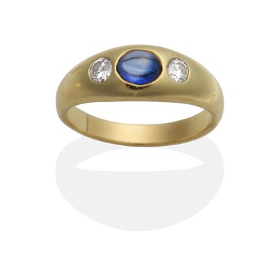 Lot 2071 - A Sapphire and Diamond Three Stone Ring, an oval cabochon sapphire between two round brilliant...