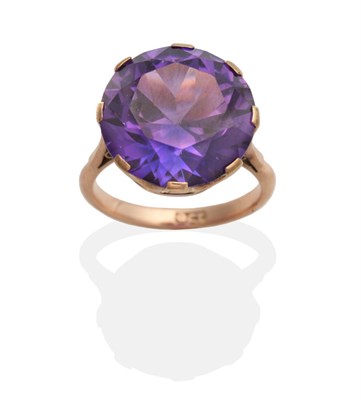 Lot 2074 - An Amethyst Ring, a round cut amethyst in a claw setting, to knife edge shoulders, finger size...