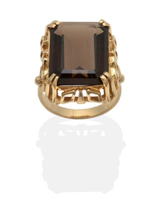 Lot 2086 - A Smokey Quartz Statement Ring, an octagonal cut smokey quartz in a claw setting with a fancy...