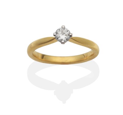 Lot 2092 - An 18 Carat Gold Diamond Solitaire Ring, a round brilliant cut diamond in a claw setting, to...