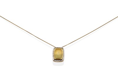 Lot 2096 - A Citrine and Diamond Pendant on Chain, an oval cabochon citrine in a rubbed over setting and a...